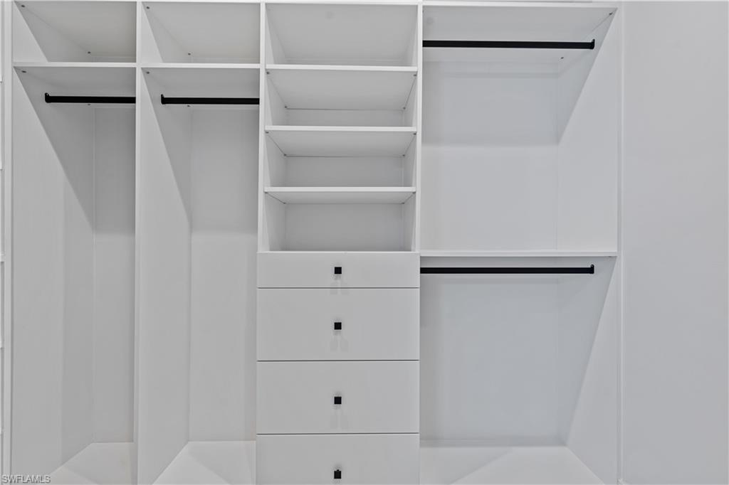 3397 14th Avenue Southeast Naples, FL 34117 - Photo 25 of 28 a view of walk in closet with empty racks