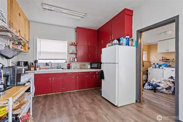 a kitchen with stainless steel appliances a refrigerator and a stove