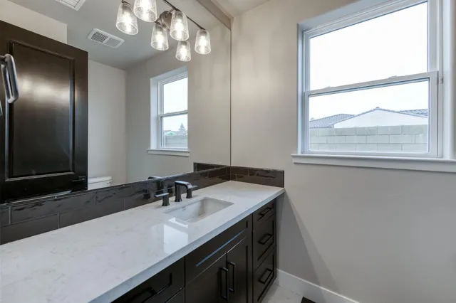 a view of a house with a yard and plants