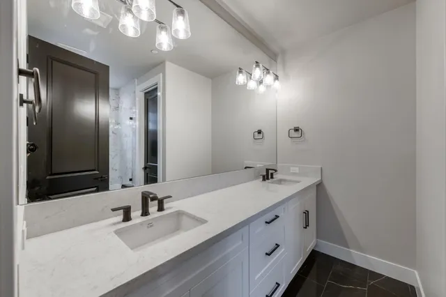 an empty room with closet and a ceiling fan