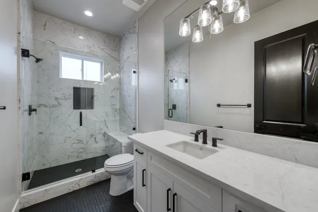 a bathroom with a double vanity sink and mirror