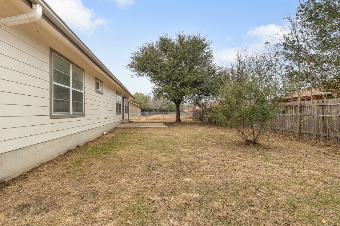 2602 Peach Tree Lane Cedar Park, TX 78613 - Photo 14 of 16 a backyard of a house with lots of green space