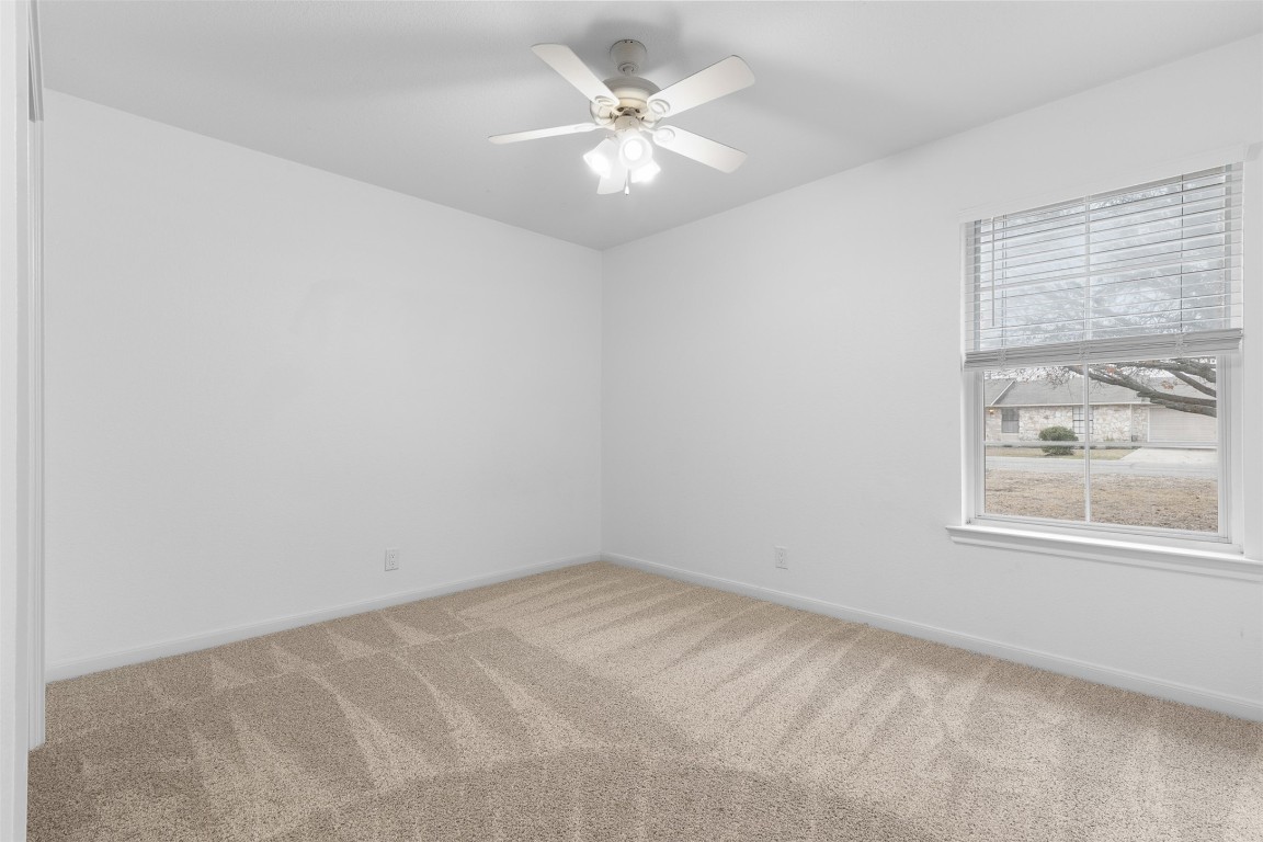 2602 Peach Tree Lane Cedar Park, TX 78613 - Photo 9 of 16 an empty room with windows and fan