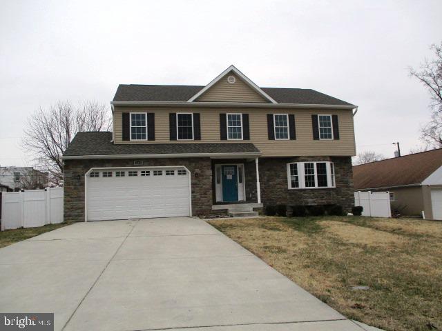 3102 Roger Road Baltimore, MD 21219 - Photo 1 of 16 a front view of a house with a yard