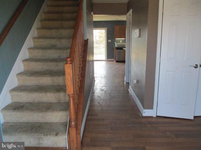 3102 Roger Road Baltimore, MD 21219 - Photo 2 of 16 a view of a hallway with wooden floor and entryway