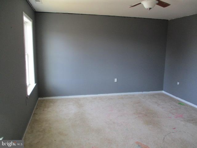 3102 Roger Road Baltimore, MD 21219 - Photo 10 of 16 a view of an empty room with a window