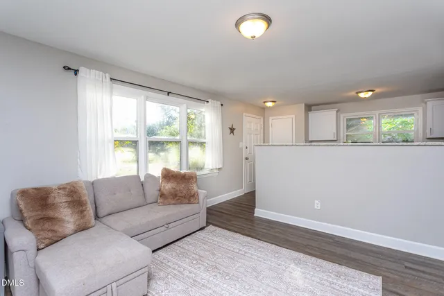 a living room with a couch and a window
