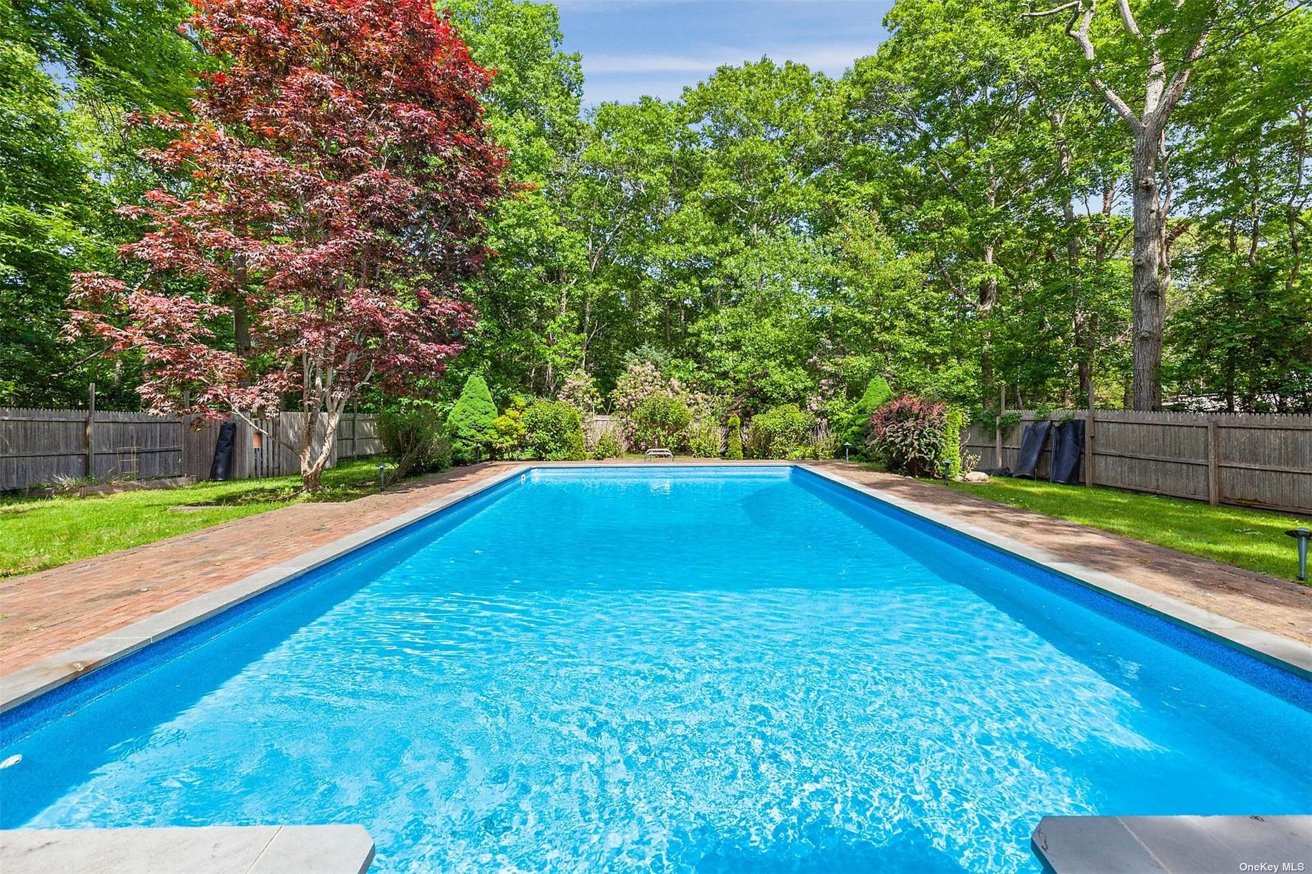 7 High Point Road East Hampton, NY 11937 - Photo 1 of 1 a view of swimming pool with a yard
