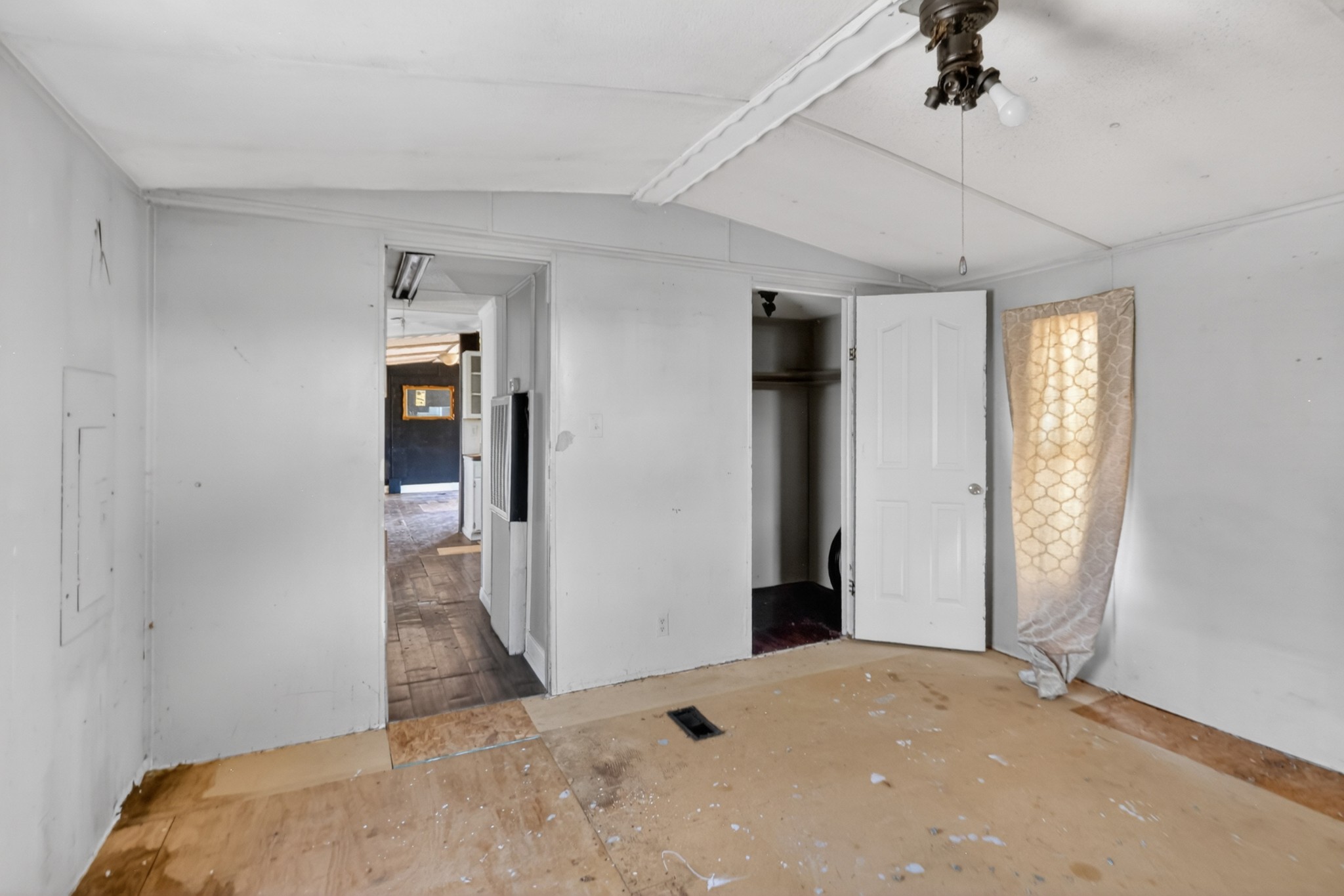 285 George Akins Road Westmoreland, TN 37186 - Photo 11 of 26 a bedroom with a bed and a chandelier fan