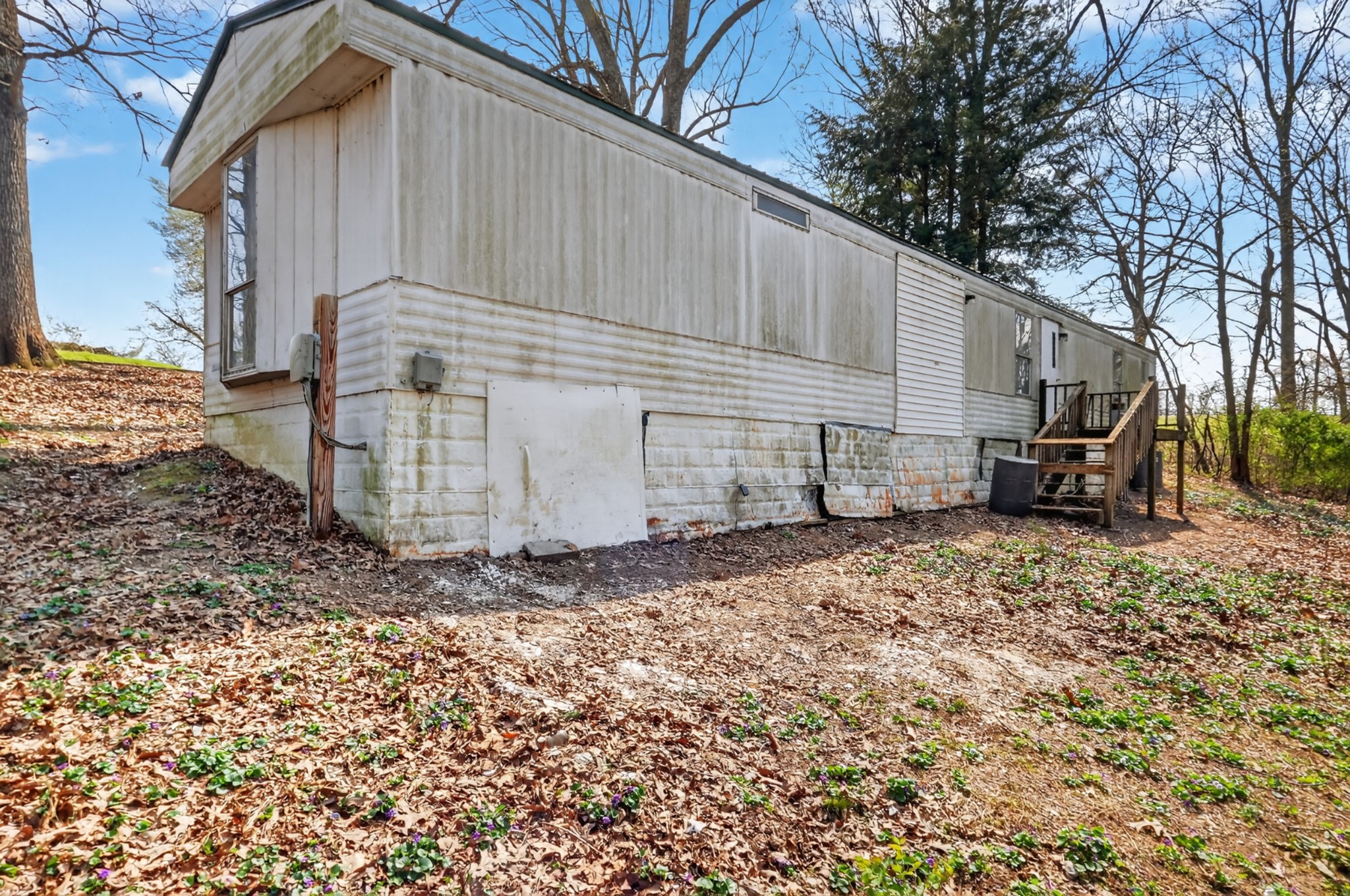 285 George Akins Road Westmoreland, TN 37186 - Photo 16 of 26 a view of a house with a backyard