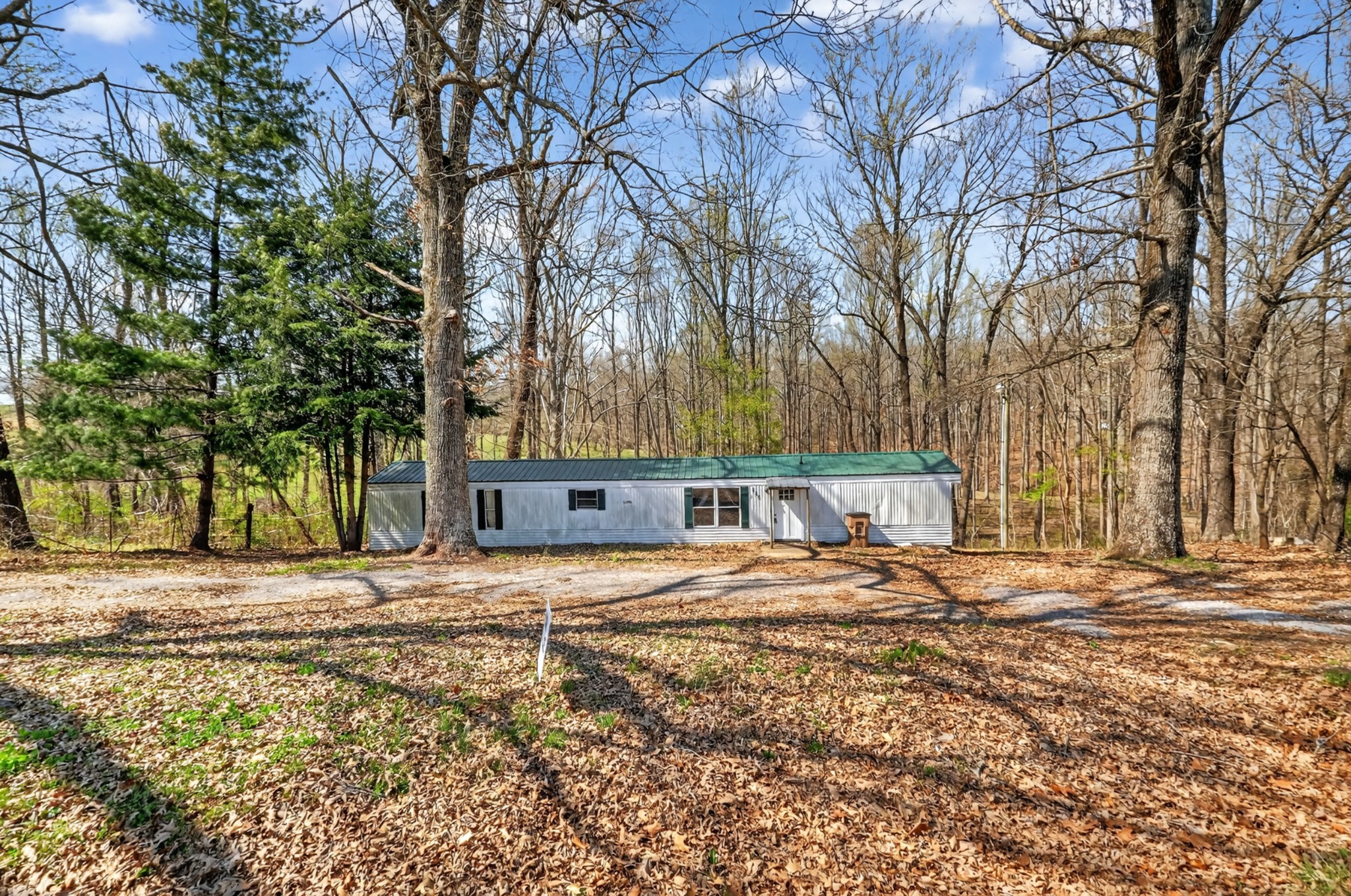 285 George Akins Road Westmoreland, TN 37186 - Photo 22 of 26 a wooden bench sitting in middle of a yard