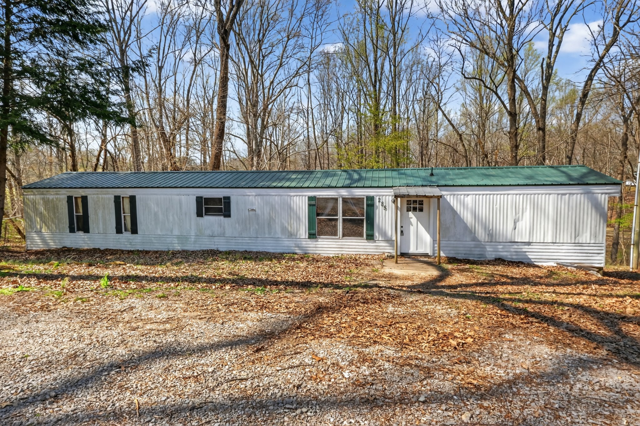 285 George Akins Road Westmoreland, TN 37186 - Photo 25 of 26 a view of a house with a yard covered with snow