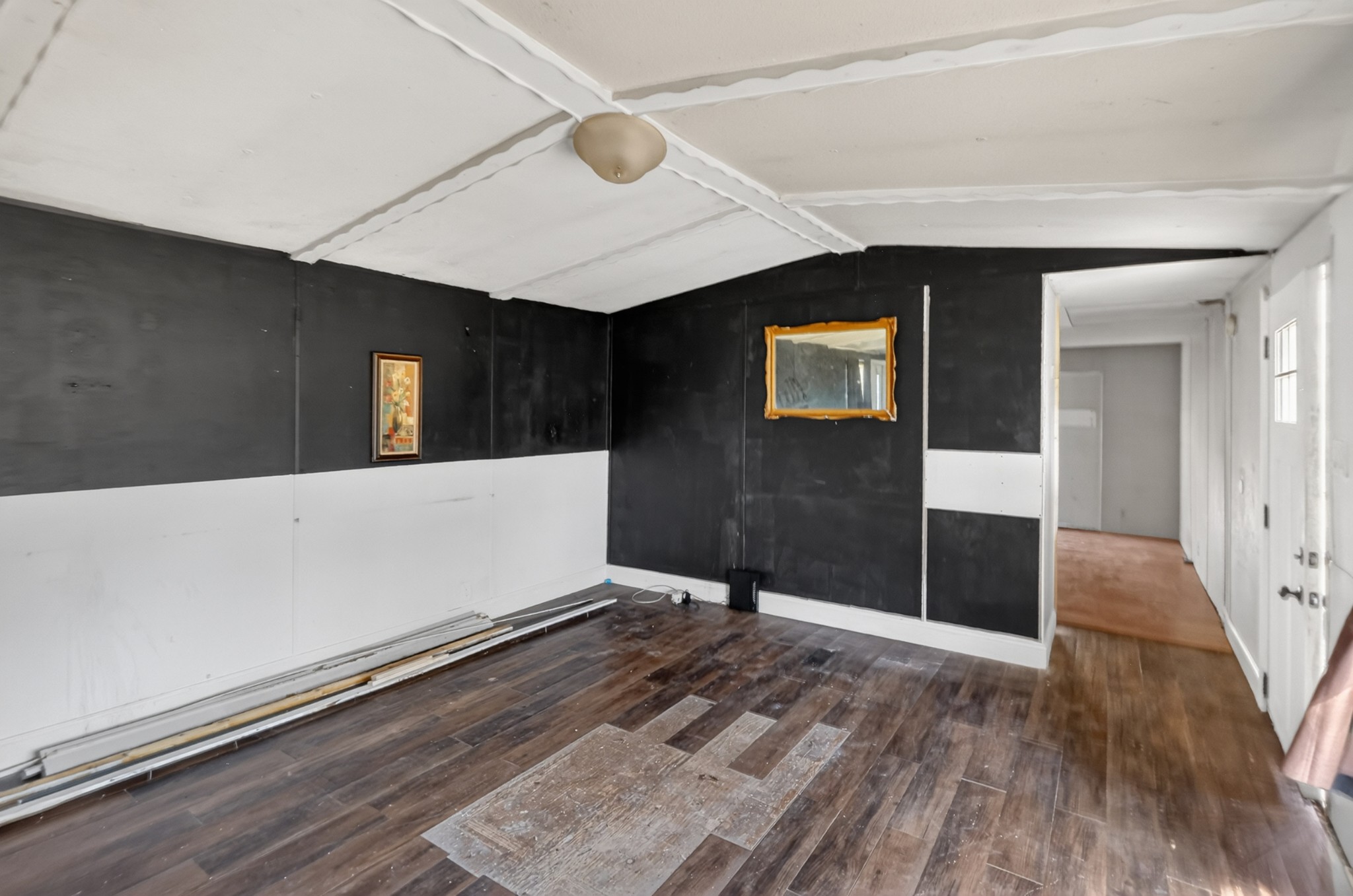 285 George Akins Road Westmoreland, TN 37186 - Photo 4 of 26 a view of an empty room with wooden floor