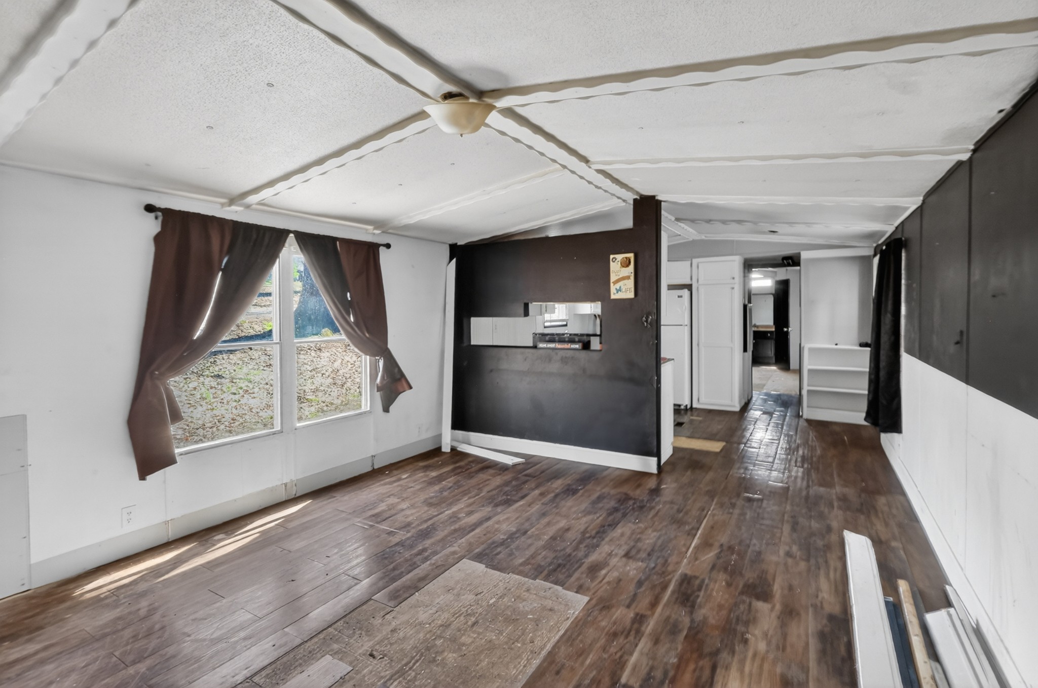 285 George Akins Road Westmoreland, TN 37186 - Photo 6 of 26 a view of hallway with a large window and wooden floor