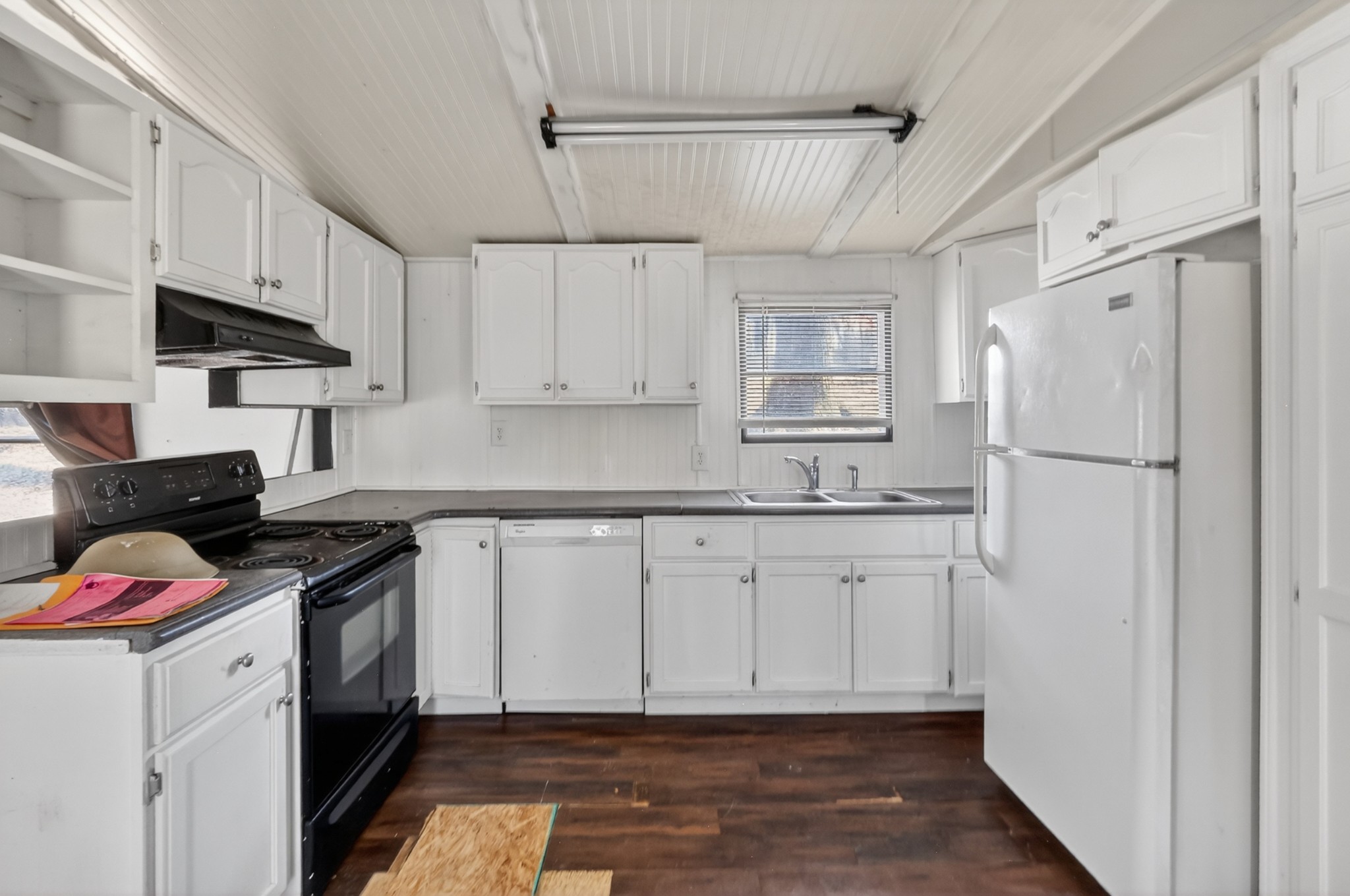 285 George Akins Road Westmoreland, TN 37186 - Photo 8 of 26 a kitchen with white cabinets and white appliances