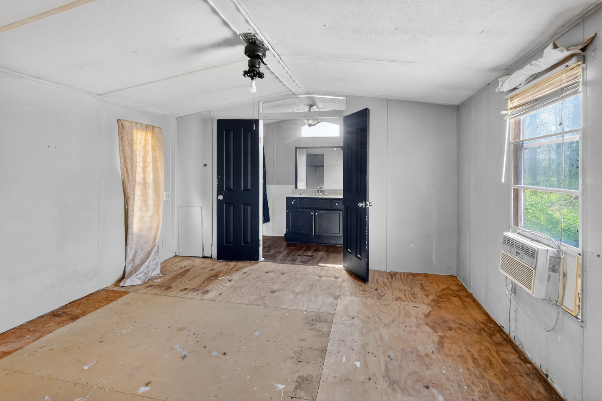 285 George Akins Road Westmoreland, TN 37186 - Photo 10 of 26 a view of a room with a sink and windows