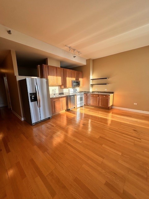 8 West Monroe Street, Unit 1206 Chicago, IL 60603 - Photo 2 of 12 a view of a kitchen with wooden floor