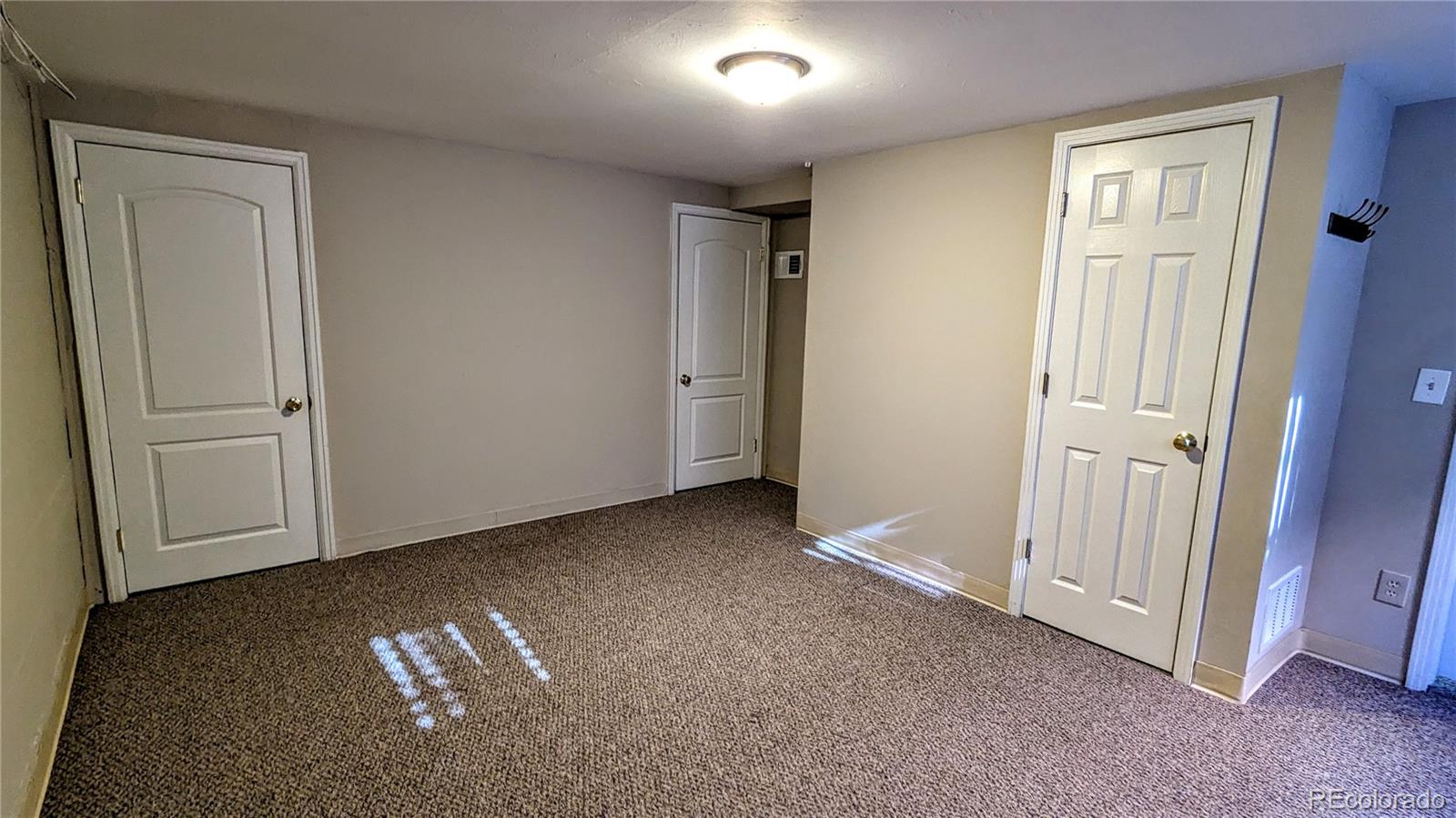 3349 Adams Street Denver, CO 80205 - Photo 20 of 31 an empty room with windows