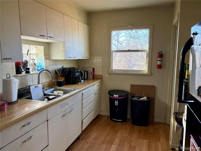 a kitchen with a stove and a refrigerator
