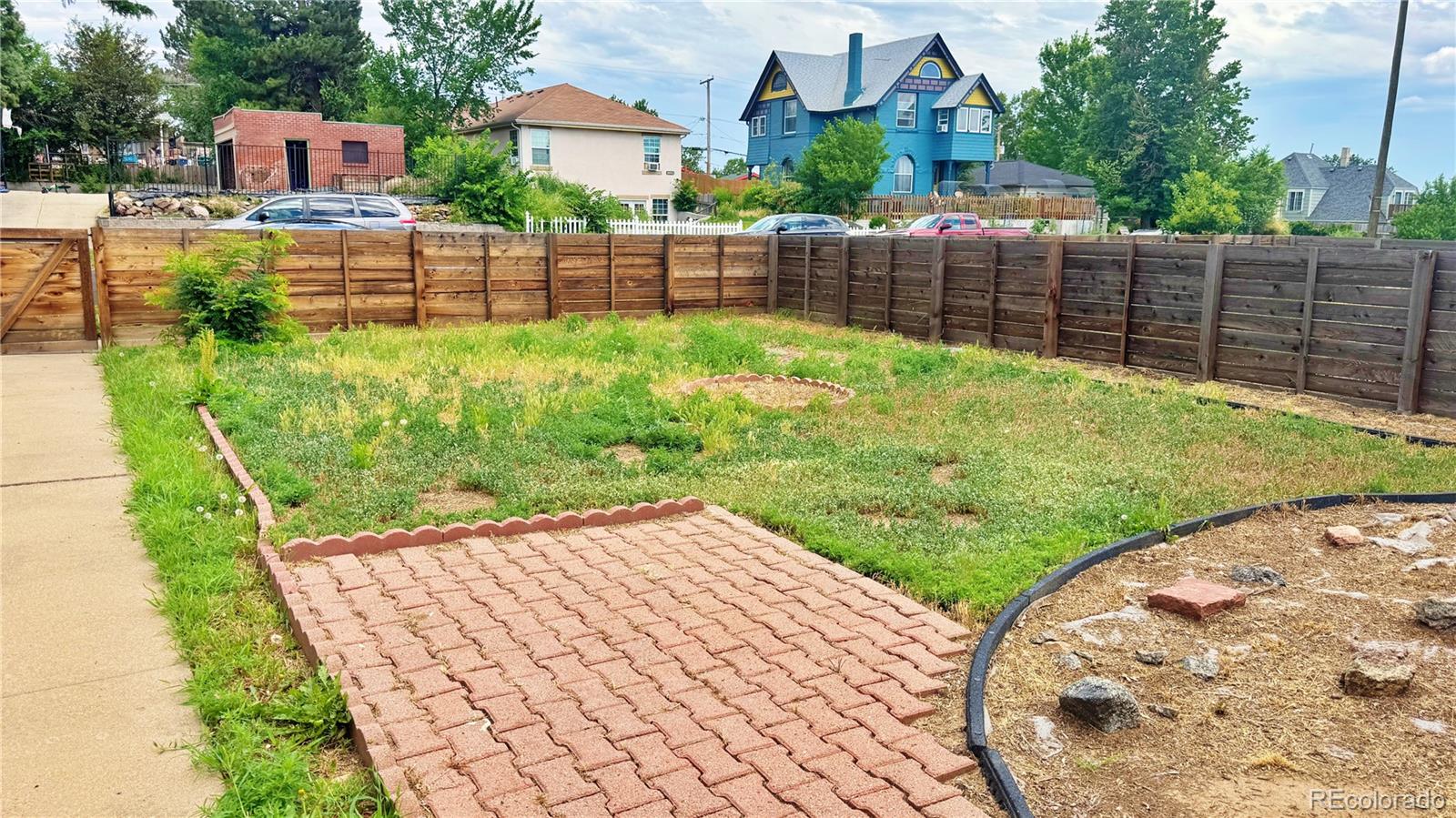 3349 Adams Street Denver, CO 80205 - Photo 3 of 31 a view of a backyard with a garden