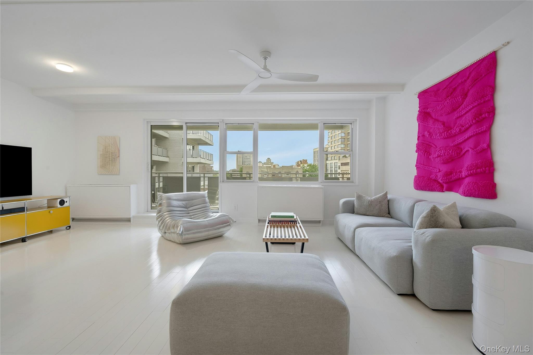 300 Martine Avenue, Unit 7B White Plains, NY 10601 - Photo 11 of 29 a living room with furniture and a flat screen tv