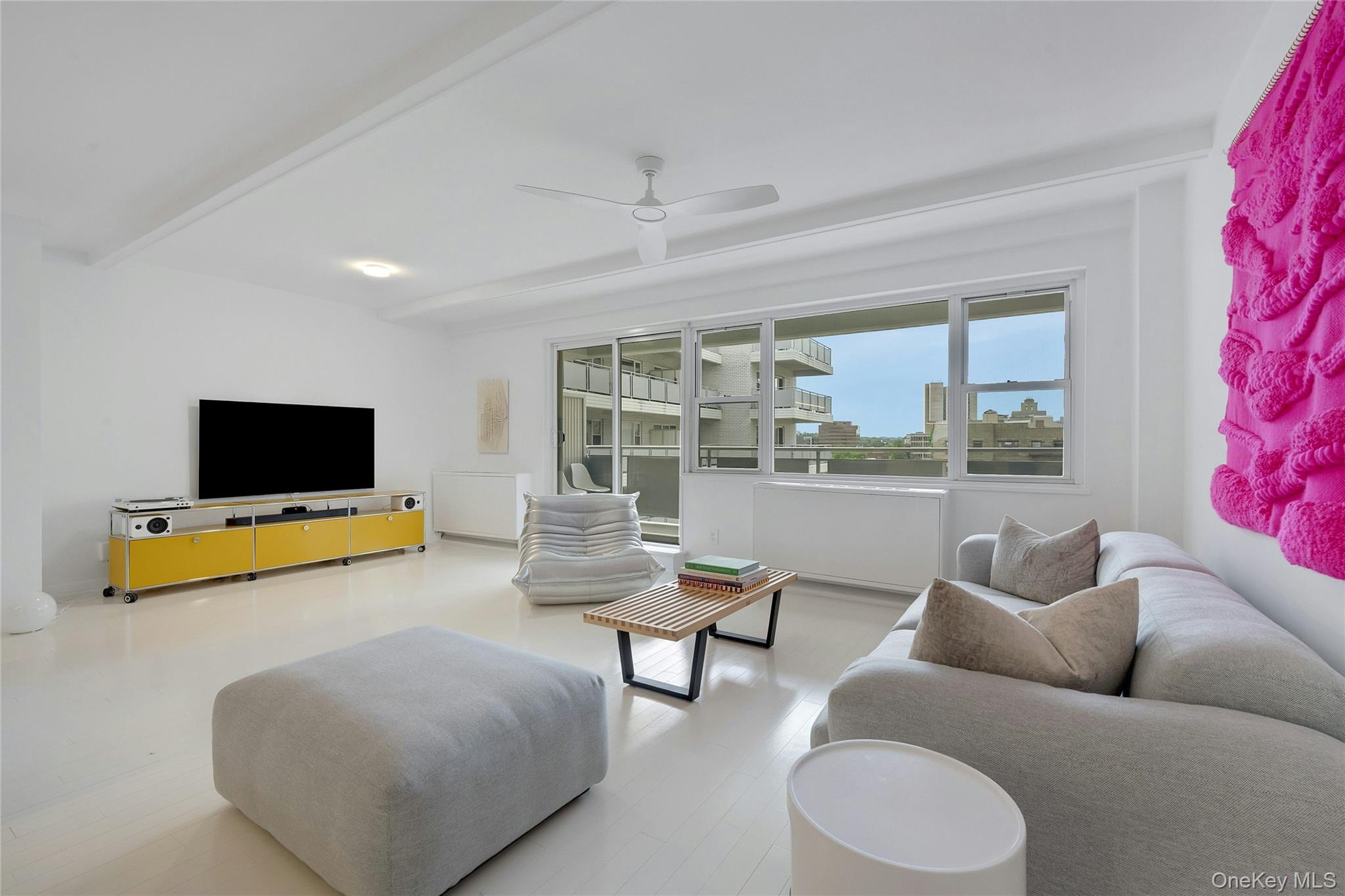 300 Martine Avenue, Unit 7B White Plains, NY 10601 - Photo 12 of 29 a living room with furniture and a flat screen tv