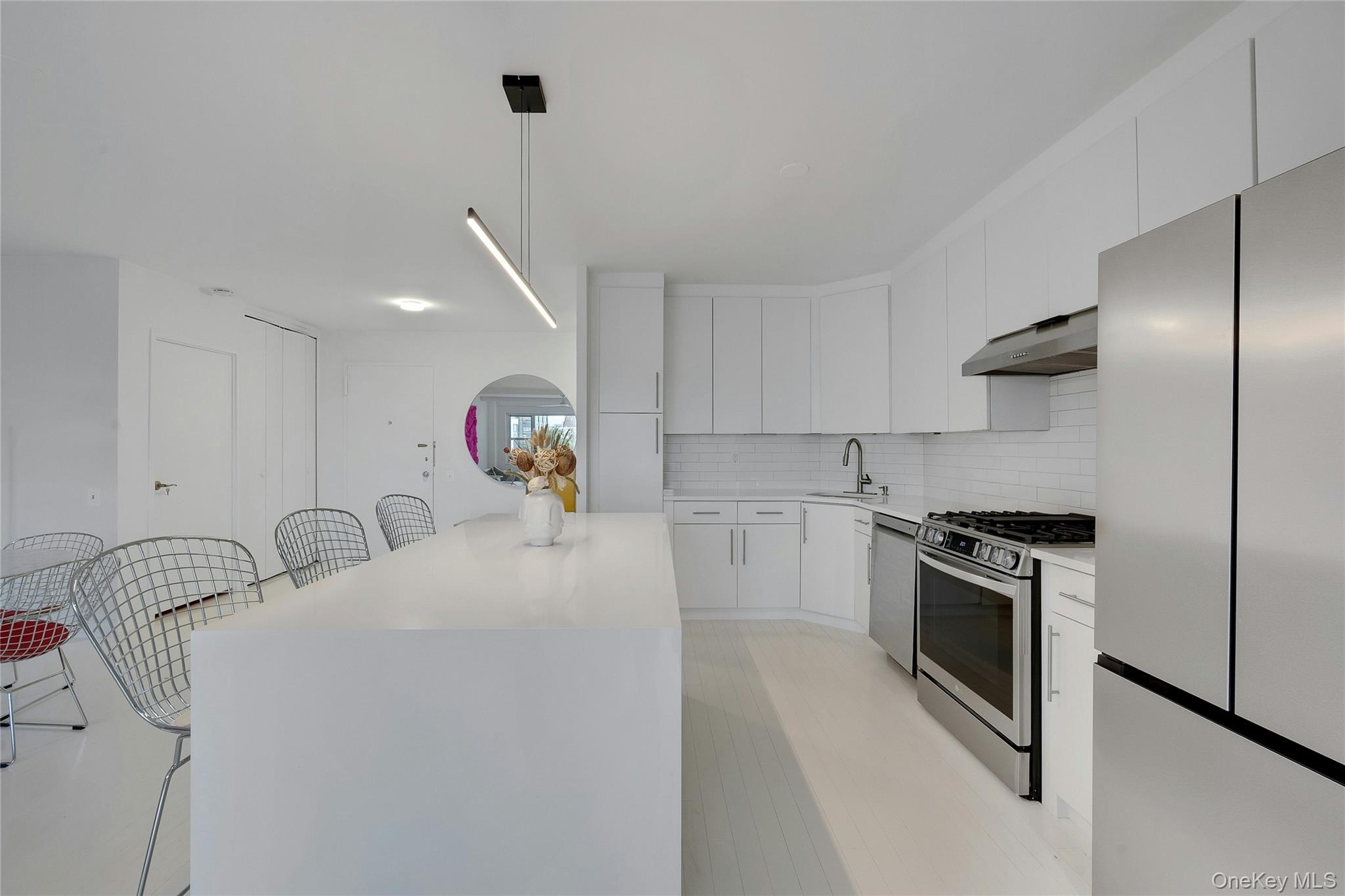 300 Martine Avenue, Unit 7B White Plains, NY 10601 - Photo 15 of 29 a kitchen with stainless steel appliances granite countertop a stove a sink and a refrigerator