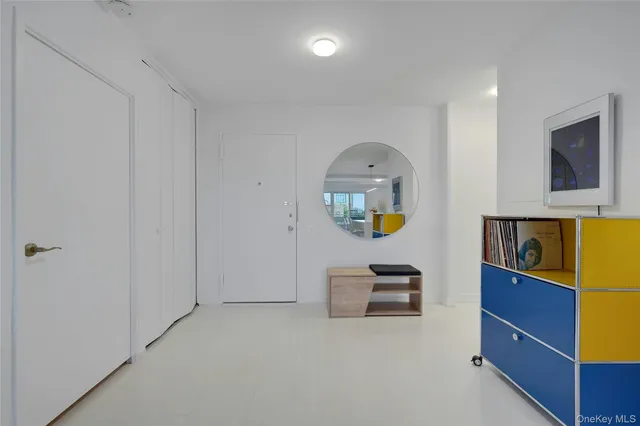 a bedroom with a bed and a dresser in it