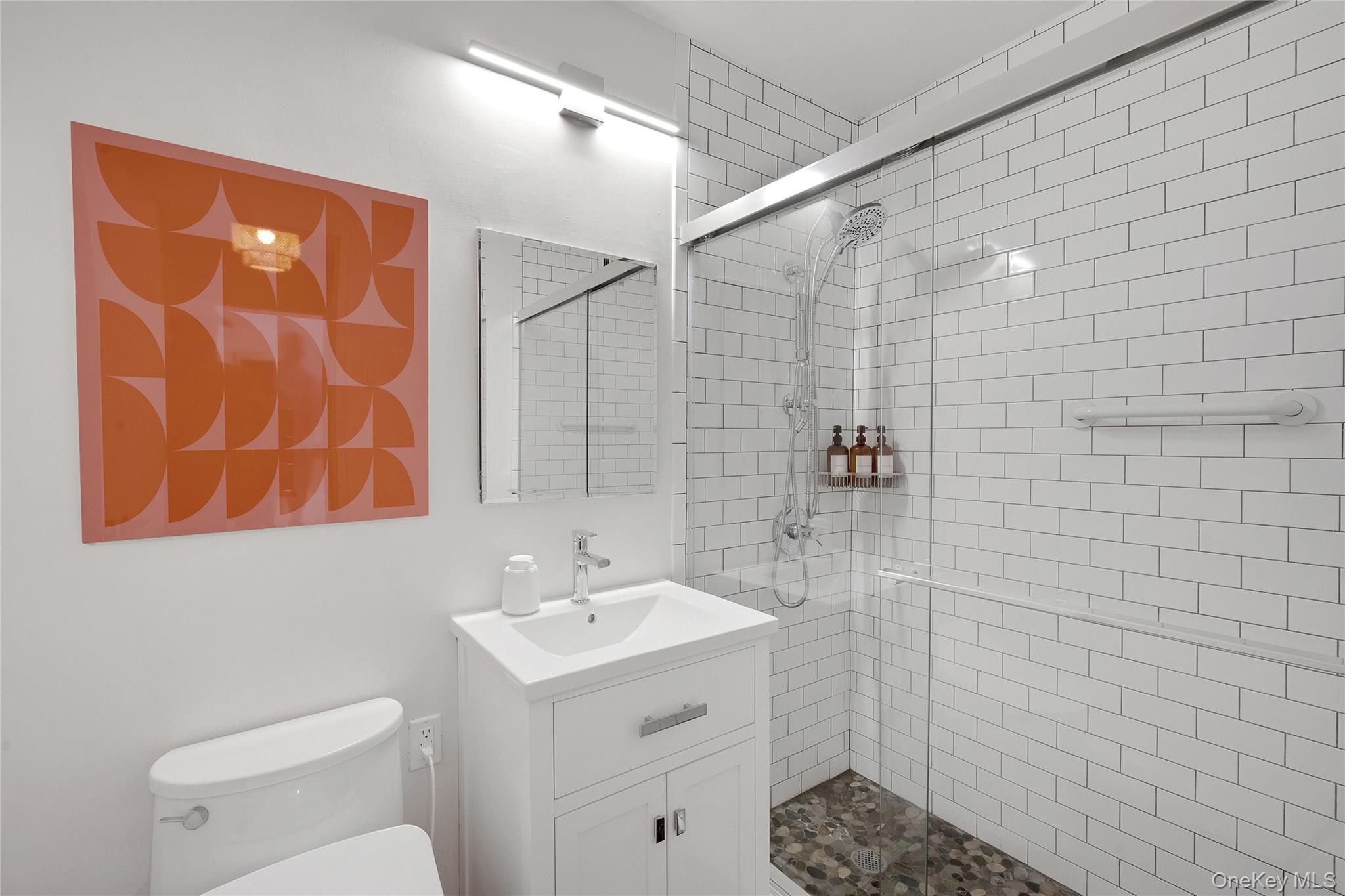 300 Martine Avenue, Unit 7B White Plains, NY 10601 - Photo 22 of 29 a bathroom with a sink a toilet and shower