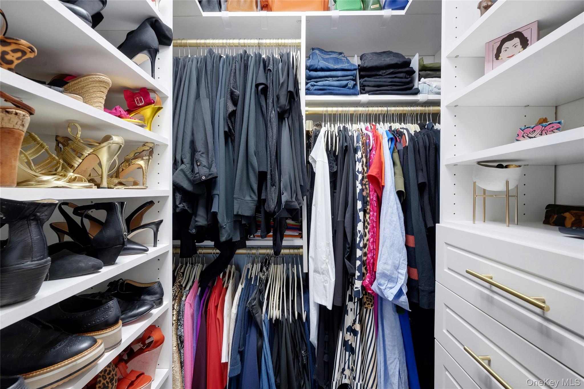 300 Martine Avenue, Unit 7B White Plains, NY 10601 - Photo 23 of 29 a view of walk in closet with clothes and shoes