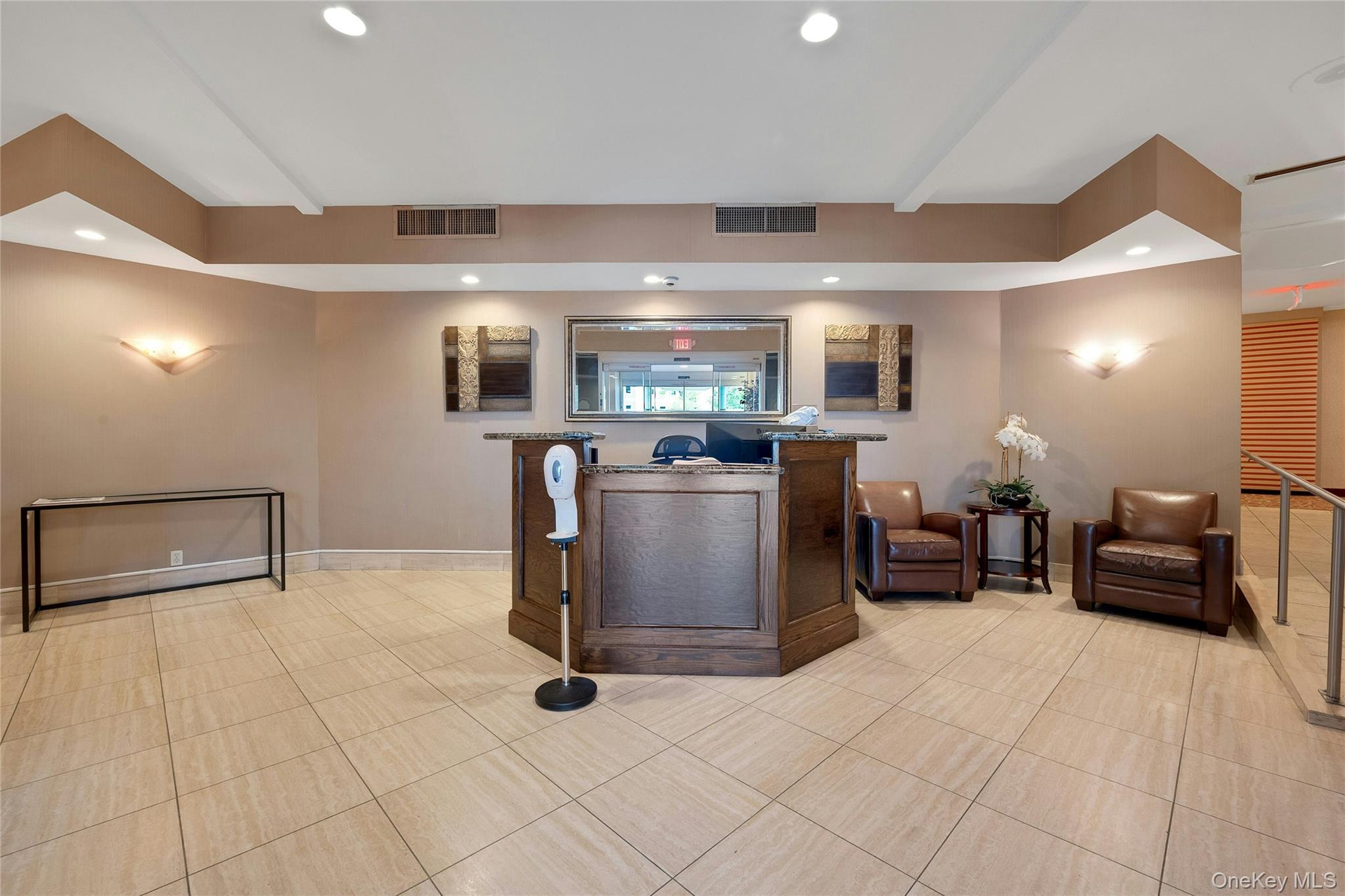 300 Martine Avenue, Unit 7B White Plains, NY 10601 - Photo 26 of 29 a living room with furniture and a flat screen tv