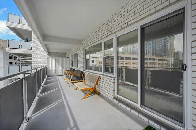 a view of a hallway with seating area