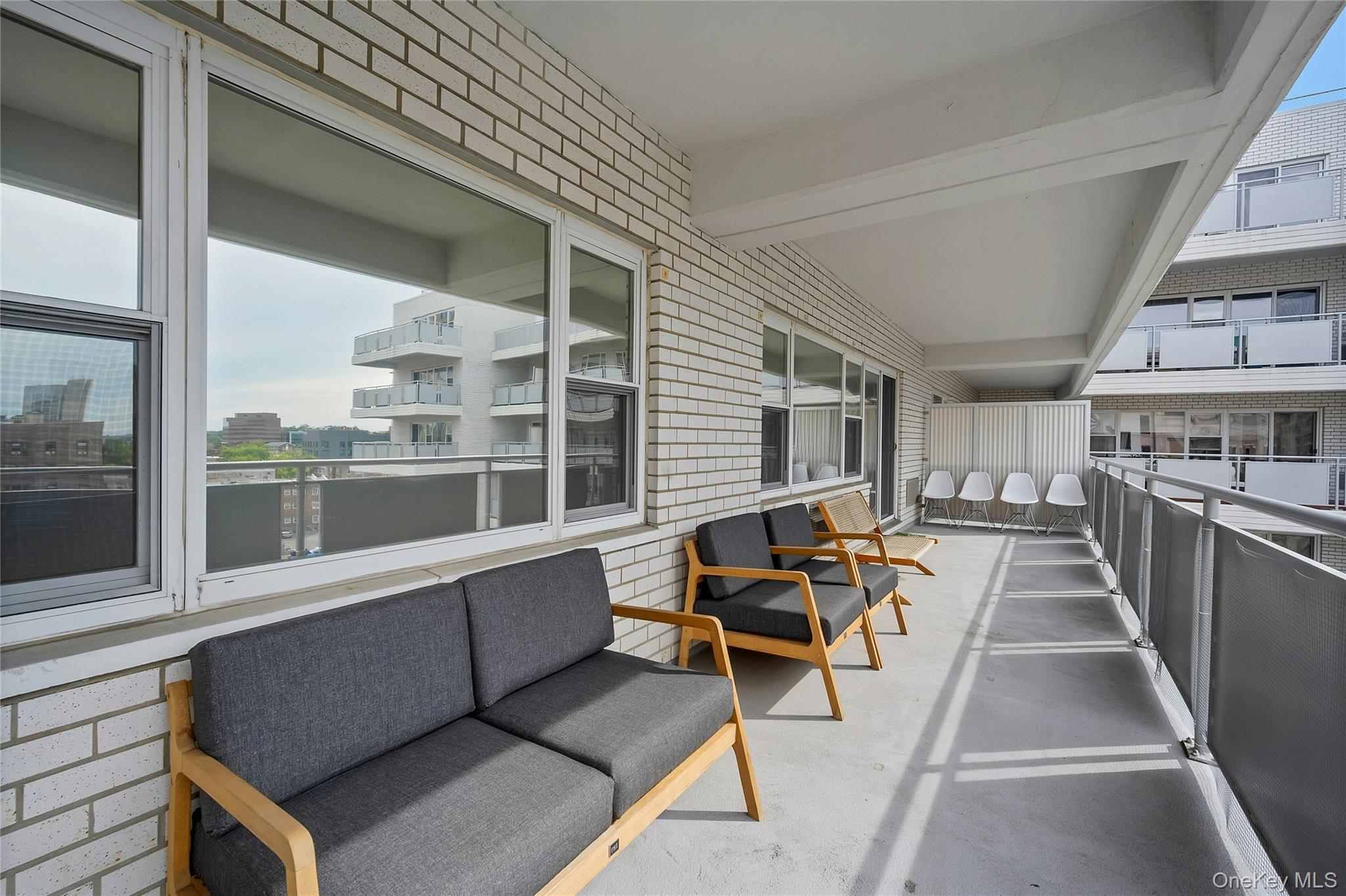 300 Martine Avenue, Unit 7B White Plains, NY 10601 - Photo 28 of 29 a view of a chairs and table in a balcony