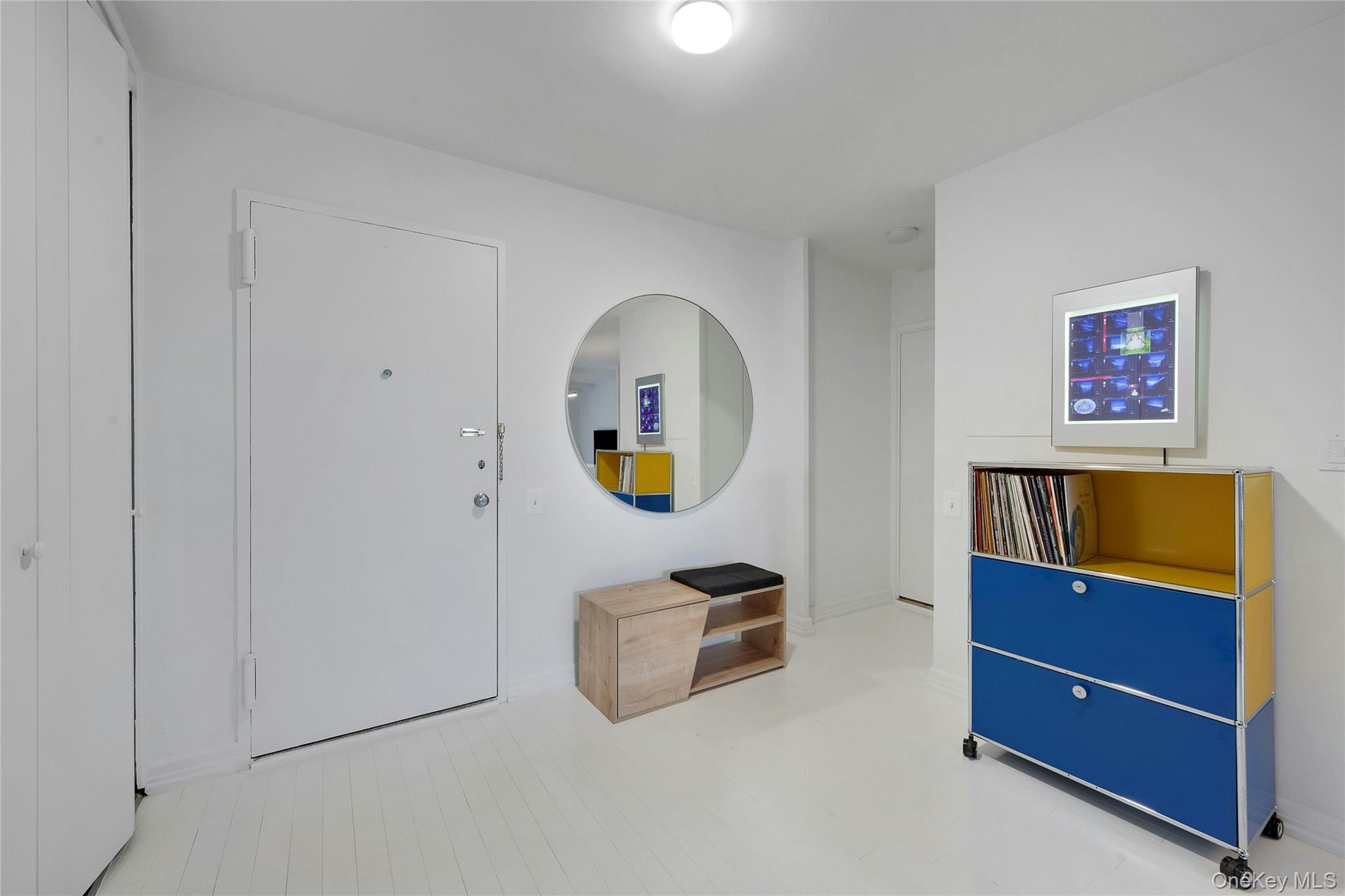 300 Martine Avenue, Unit 7B White Plains, NY 10601 - Photo 3 of 29 a living room with furniture and a flat screen tv