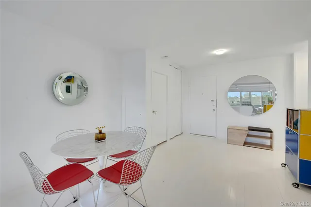 a bedroom with furniture and a wooden floor