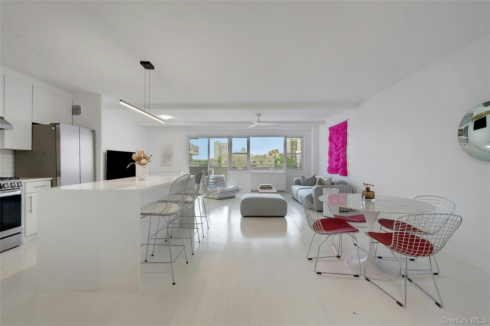 300 Martine Avenue, Unit 7B White Plains, NY 10601 - Photo 8 of 29 a living room with furniture and a flat screen tv