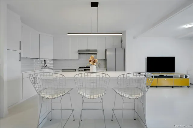 a living room with a couch and a flat screen tv