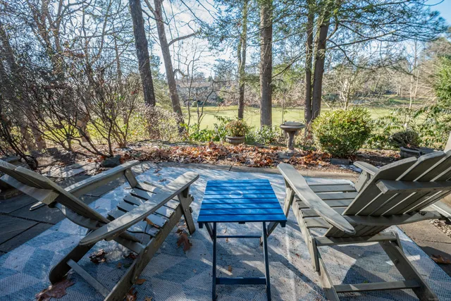 a view of a chairs and tables in the patio