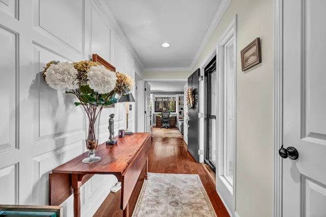 a view of a hallway with furniture