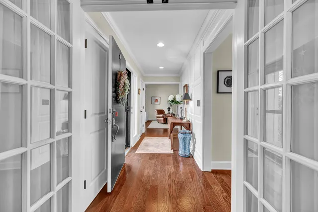 a view of a hallway view with wooden floor and staircase