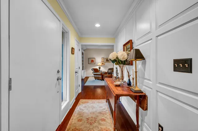 a view of living room with furniture and wooden floor