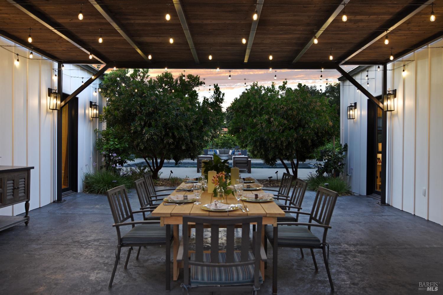 85 Trinity Road Glen Ellen, CA 95442 - Photo 52 of 62 a view of an outdoor dining space with a table and chairs