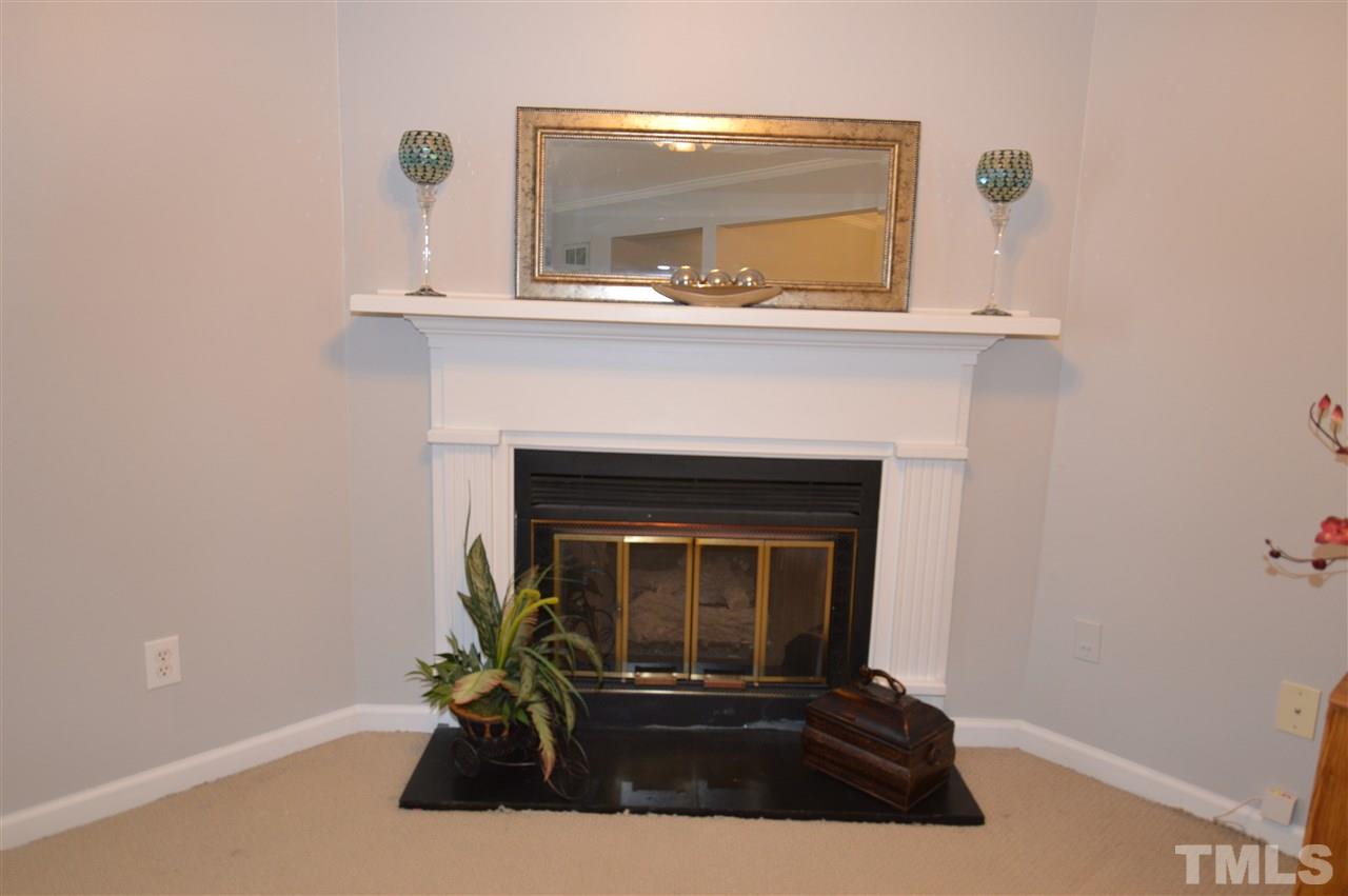 6587 English Oaks Drive Raleigh, NC 27615 - Photo 6 of 21 Corner fireplace in the family room