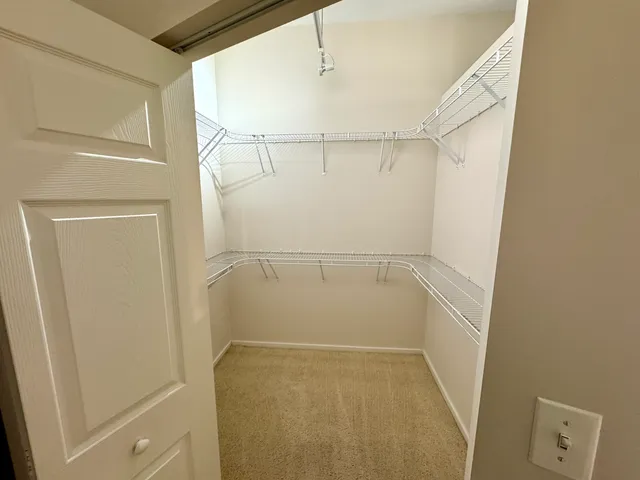 a bathroom with a double vanity sink a mirror and a bathtub