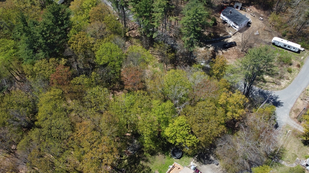 Lot 3 Beacon Street Orange, MA 01364 - Photo 4 of 4 an aerial view of residential house with outdoor space and trees all around