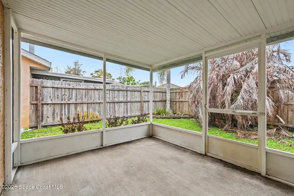 a view of house with backyard and porch
