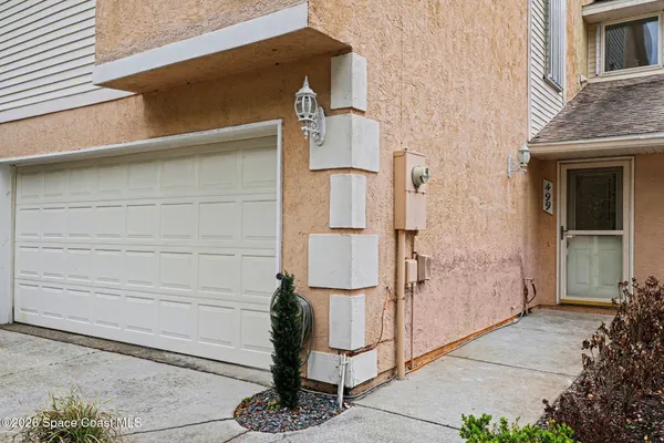 a front view of a house with garage