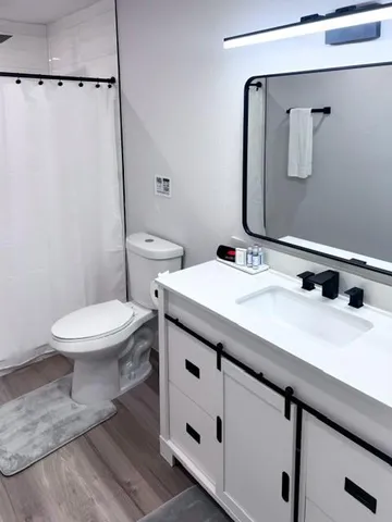 a view of an entryway with wooden floor