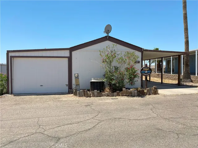 a view of a building with snow on the road