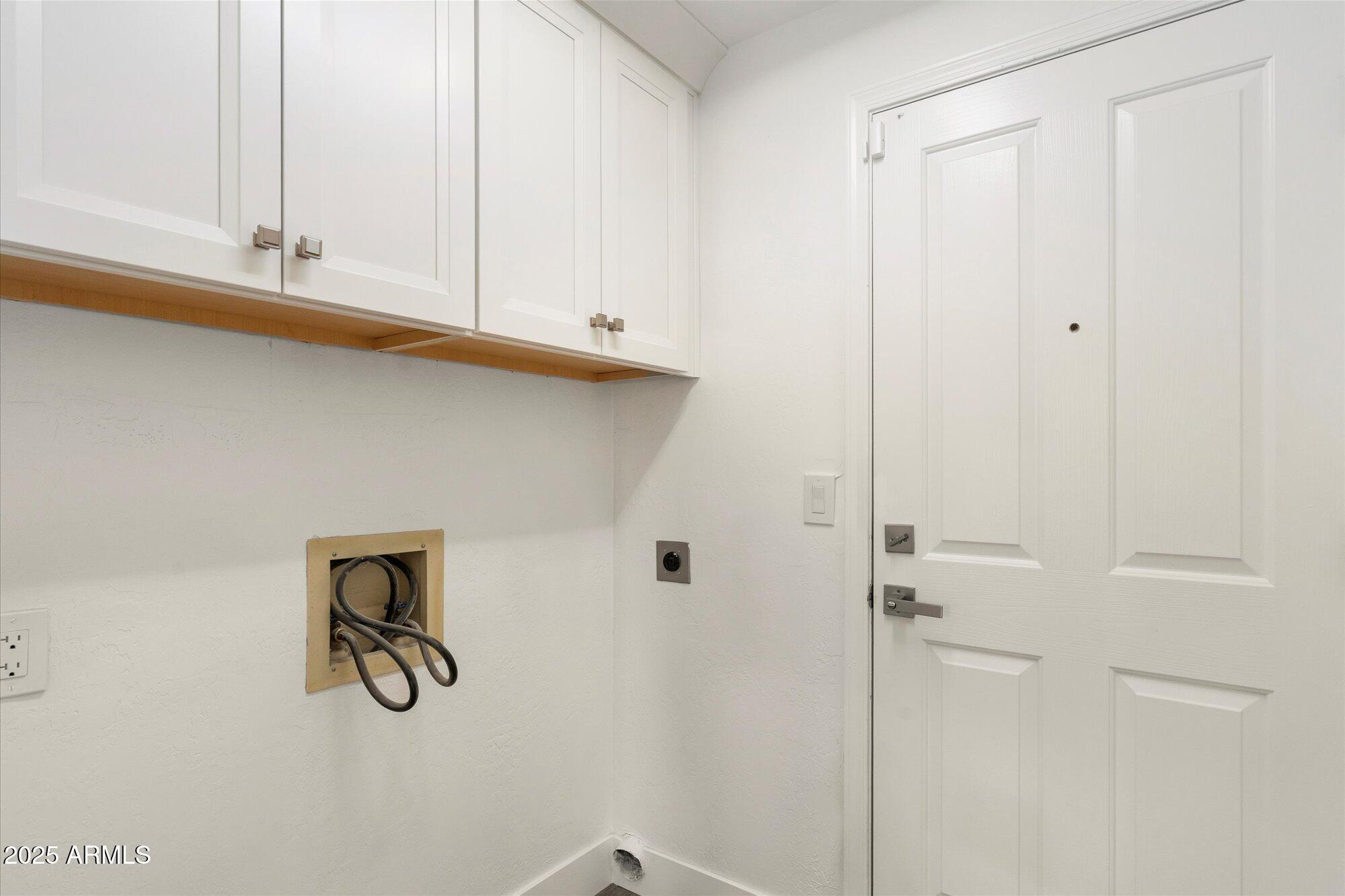 7955 East Chaparral Road, Unit 17 Scottsdale, AZ 85250 - Photo 42 of 57 Laundry Room with New Cabinetry